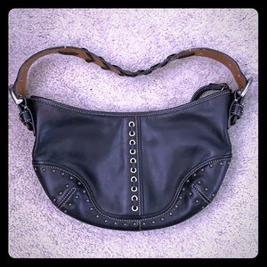 Coach purse with studs and stitching detail